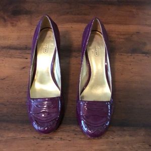 Coach patent pumps